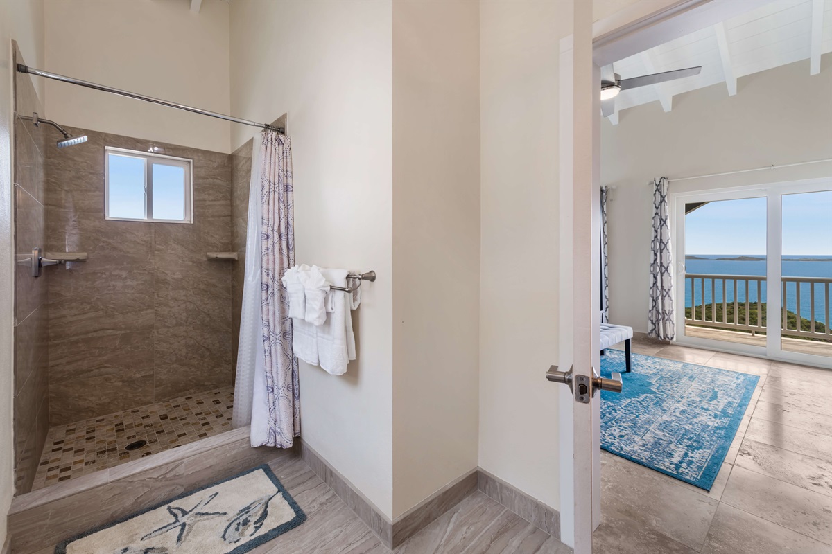 Another view of the ensuite bathroom with thoughtful amenities for comfort.