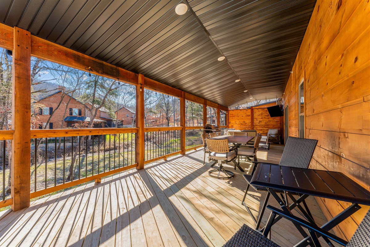 Extended covered porch with plenty of room to lounge and unwind.