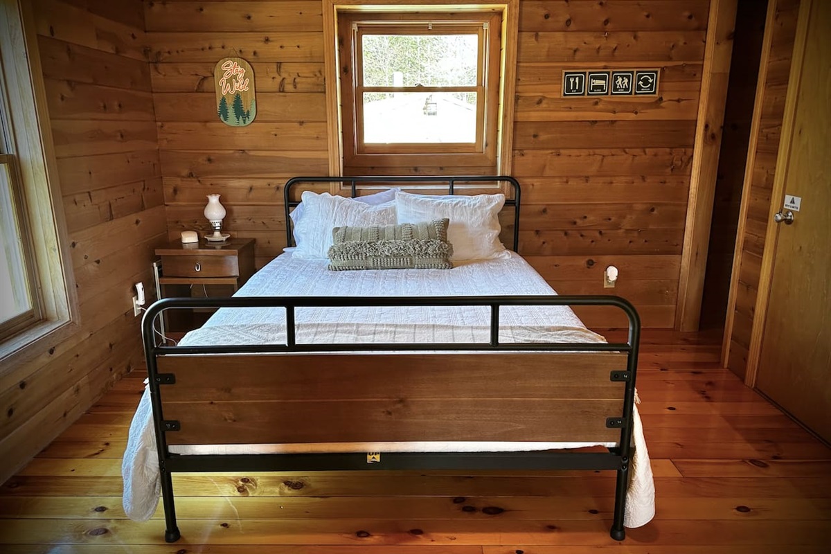 Loft overlooking the living room with a queen bed