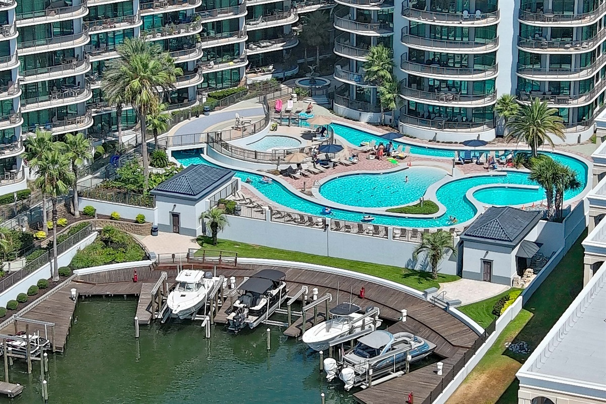 Experience unparalleled amenities. This property features a magnificent lazy river, sparkling pools, and a hot tub, offering the perfect retreat for residents and guests. A true vacation lifestyle every day.