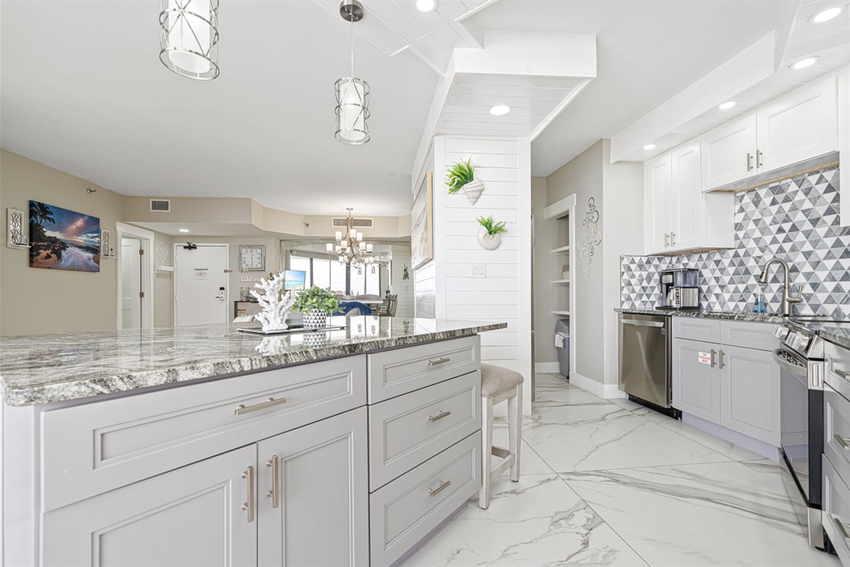 This is the kind of kitchen layout that makes a vacation rental feel like a luxury home. Generous counter space, custom storage throughout, and a design that flows seamlessly into the rest of the condo.