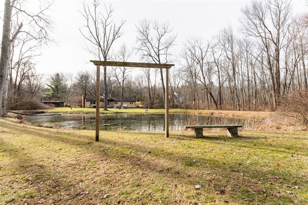 Opposite side of pond with small seating and picture area.
