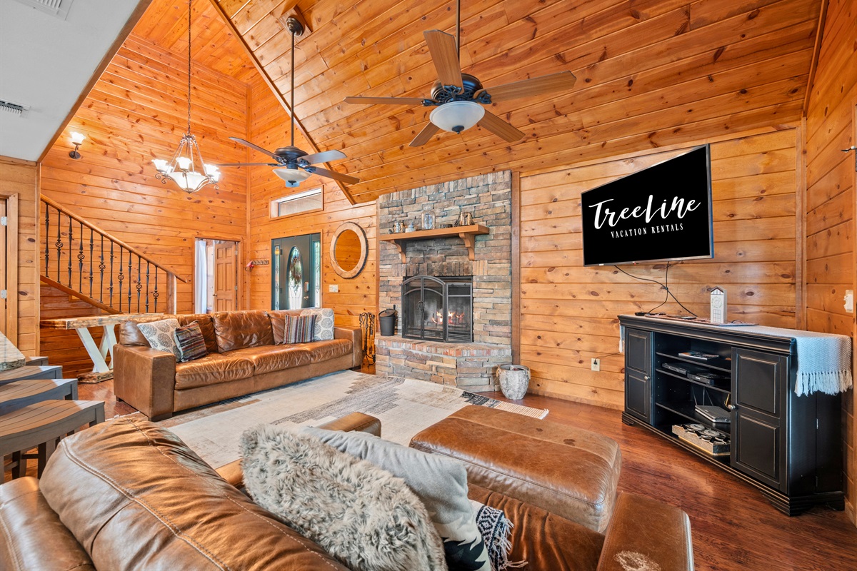 Wood-paneled cathedral ceiling and plenty of natural light make this space extra inviting.