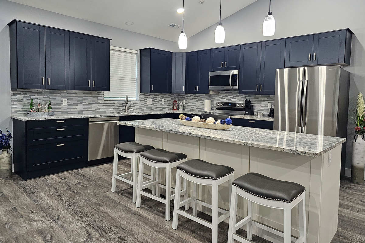 Chef‑ready kitchen with modern appliances and plenty of prep and seating space.