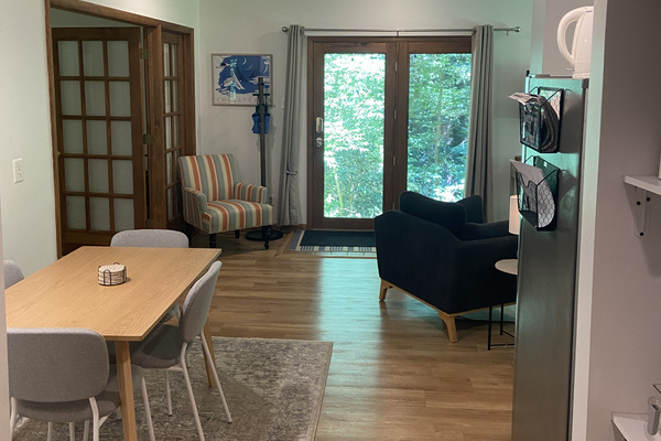 View of front door & dining area. Bedroom to left, kitchen & living room to right.