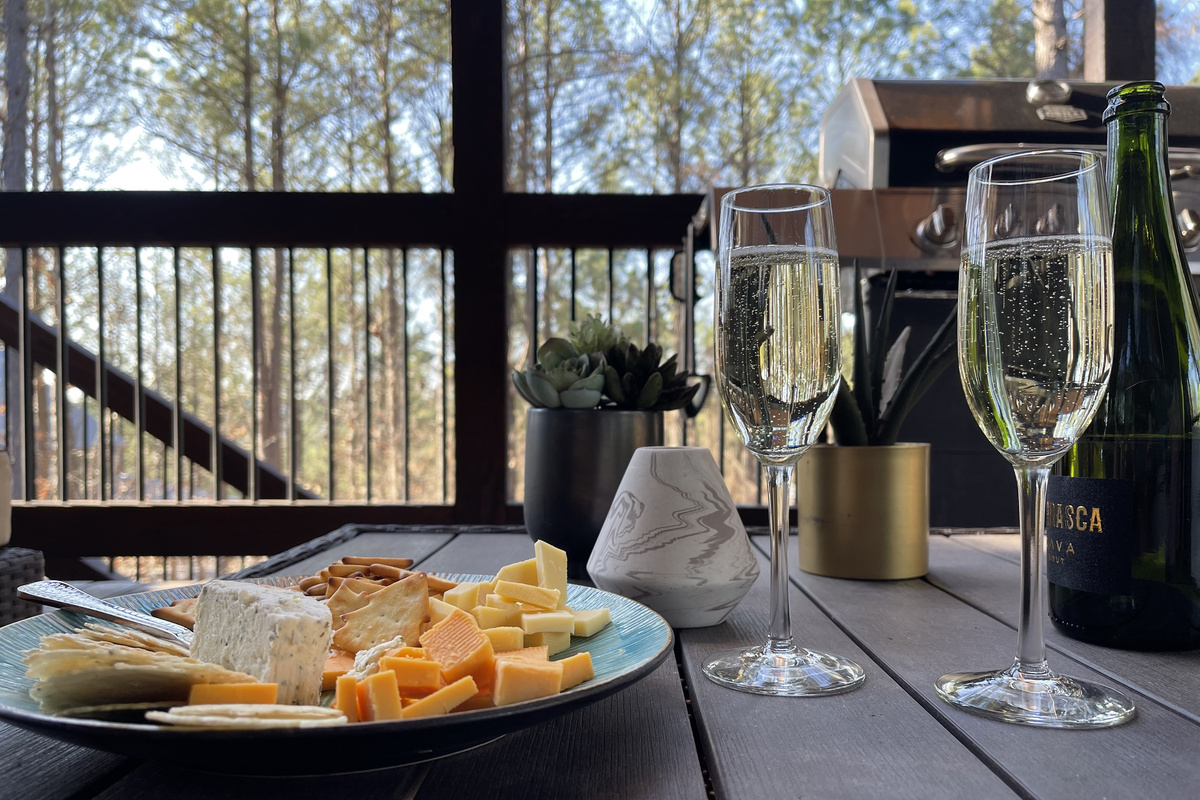 One of our favorite places at the First Kiss cabin…peaceful back porch patio with our favorite afternoon snacks and some bubbly!
