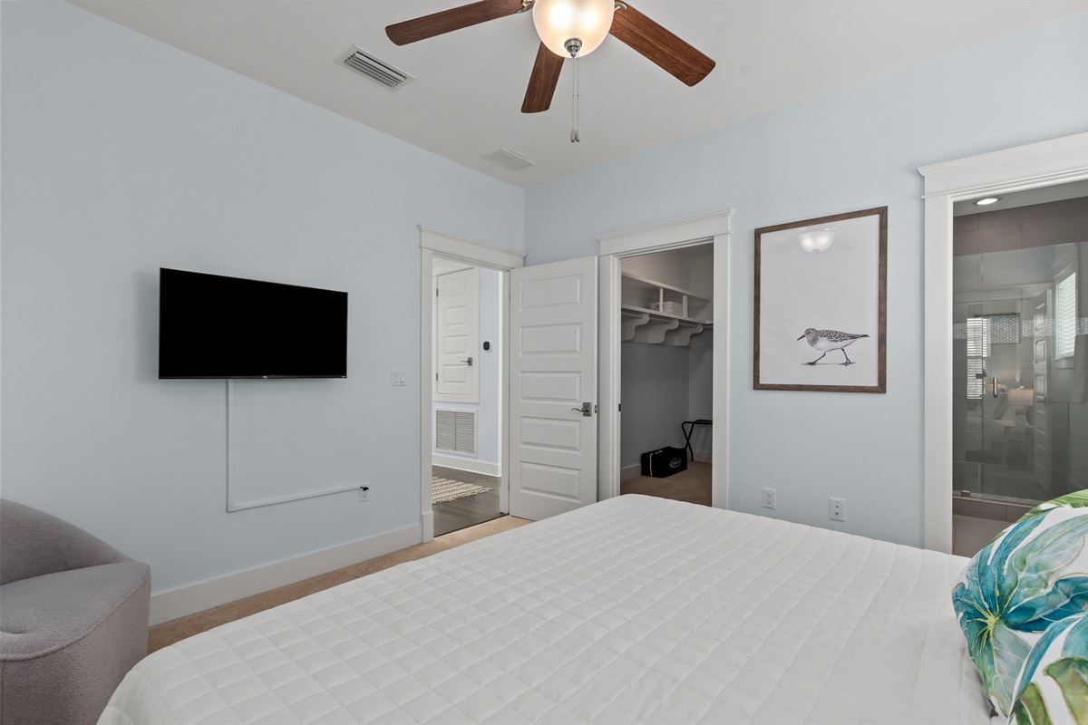 This secondary upstairs master bedroom has a king size bed and ensuite bathroom.