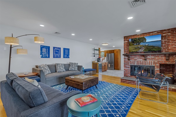 Enjoy a game with friends and family or cozy up by the fireplace in the spacious living room as the weather changes.