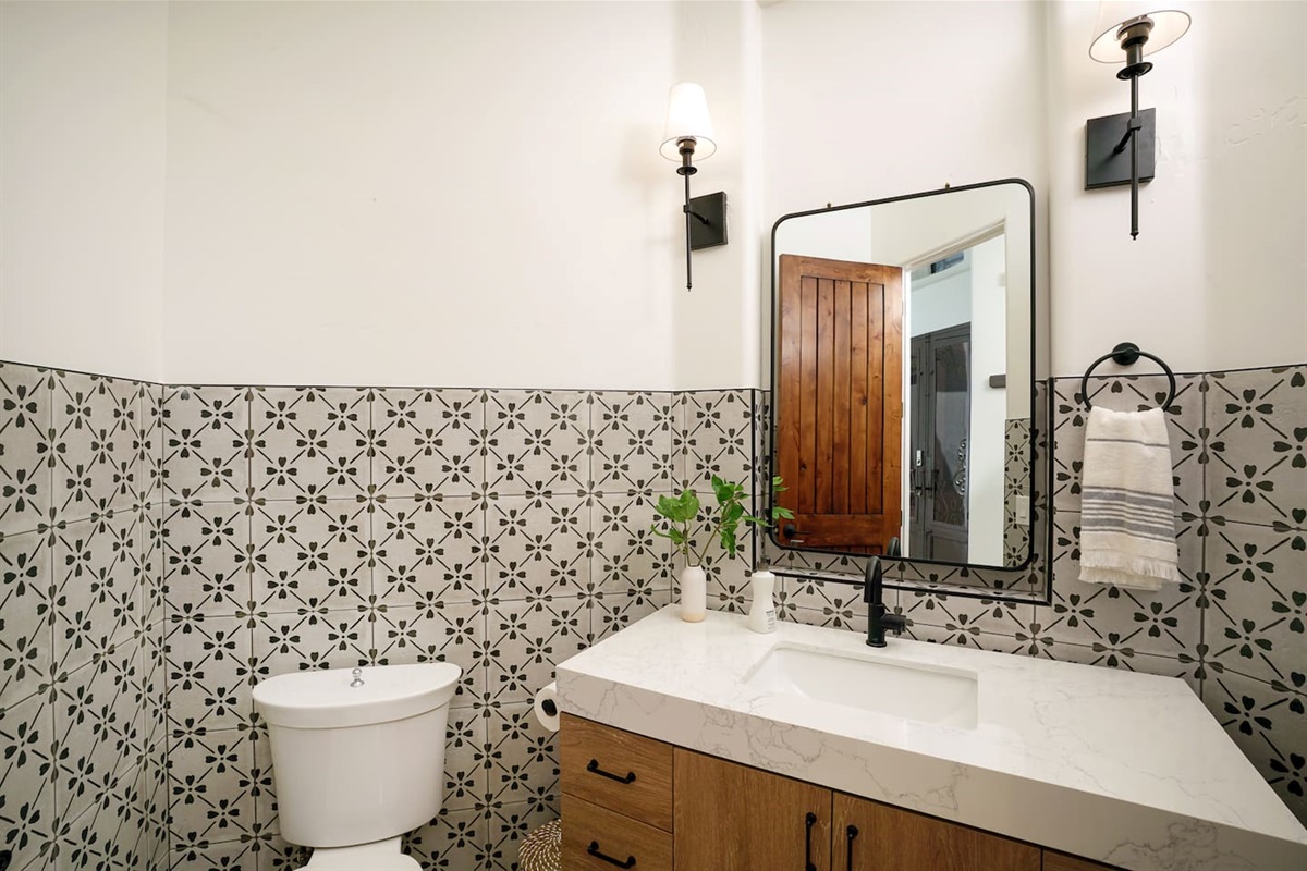 1/2 bath located directly off the Bunk Room in hallway.