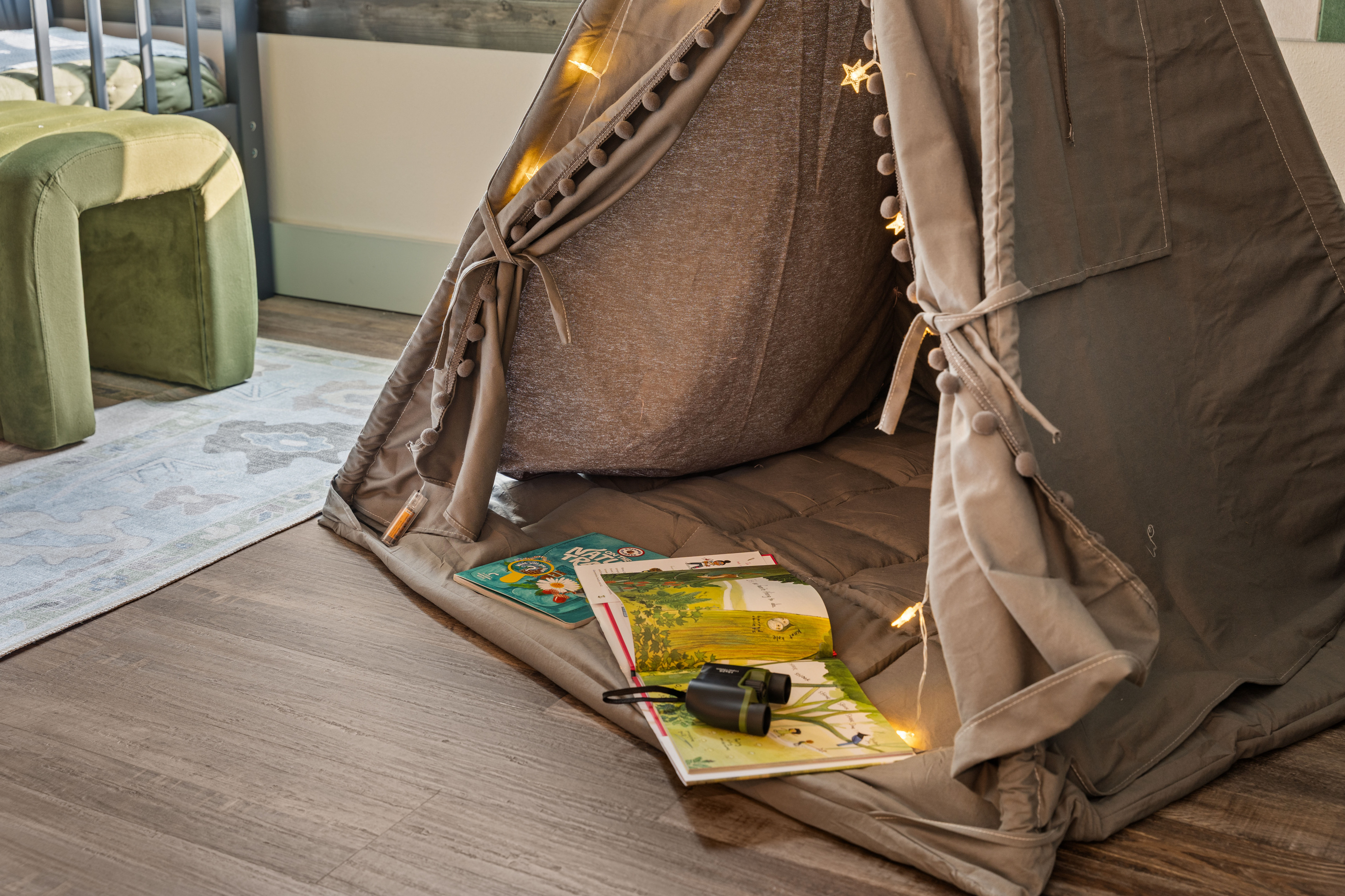 Grab a book and a flashlight and disappear into the bunk-room teepee for the night.