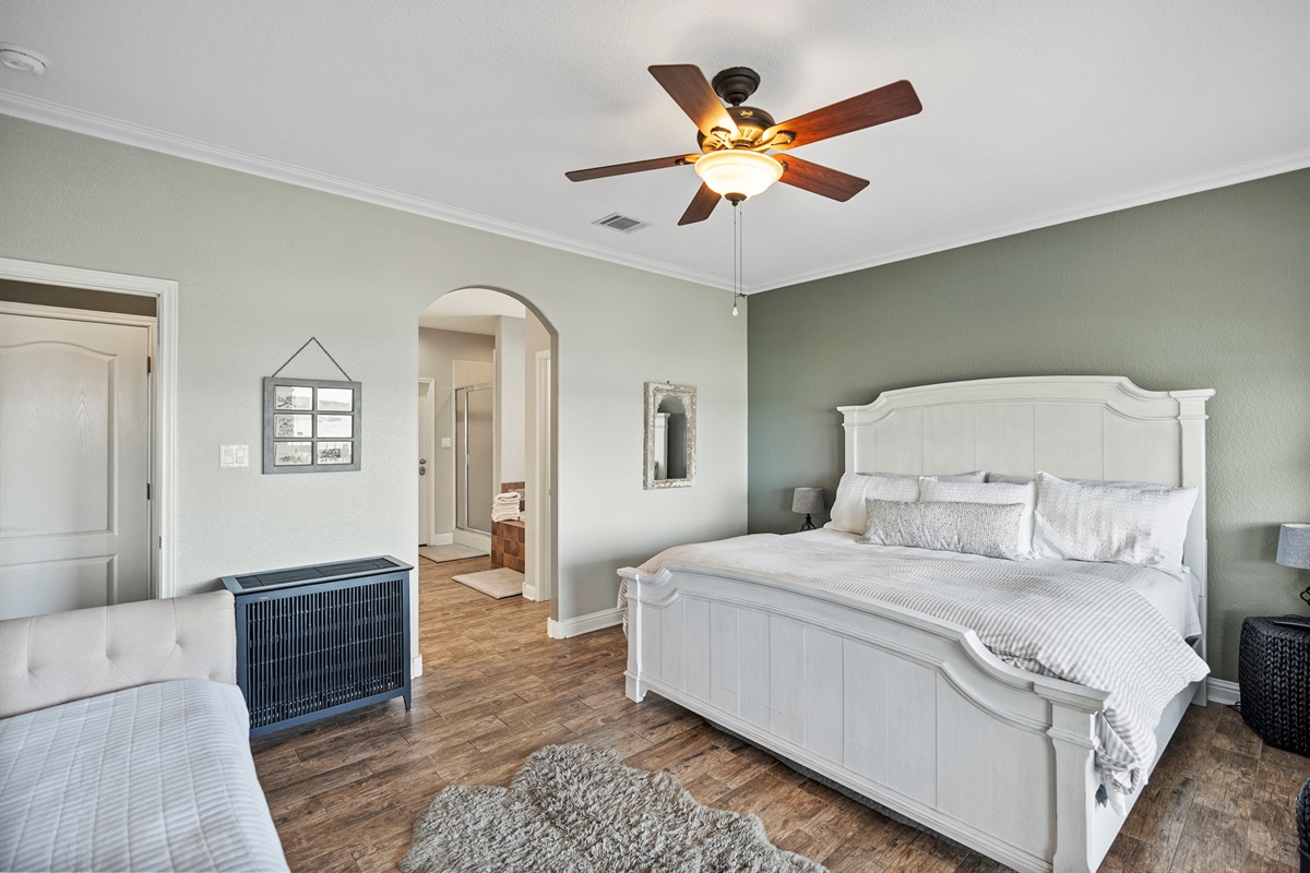 King bed with private en-suite bathroom, smart TV, and a twin trundle perfect for families or added flexibility.
