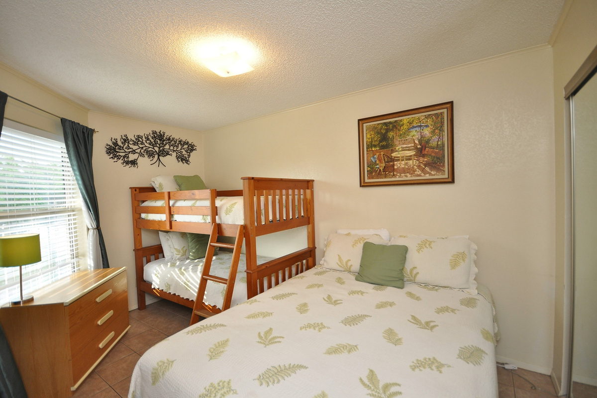 Secondary bedroom has flexible sleeping accommodations.