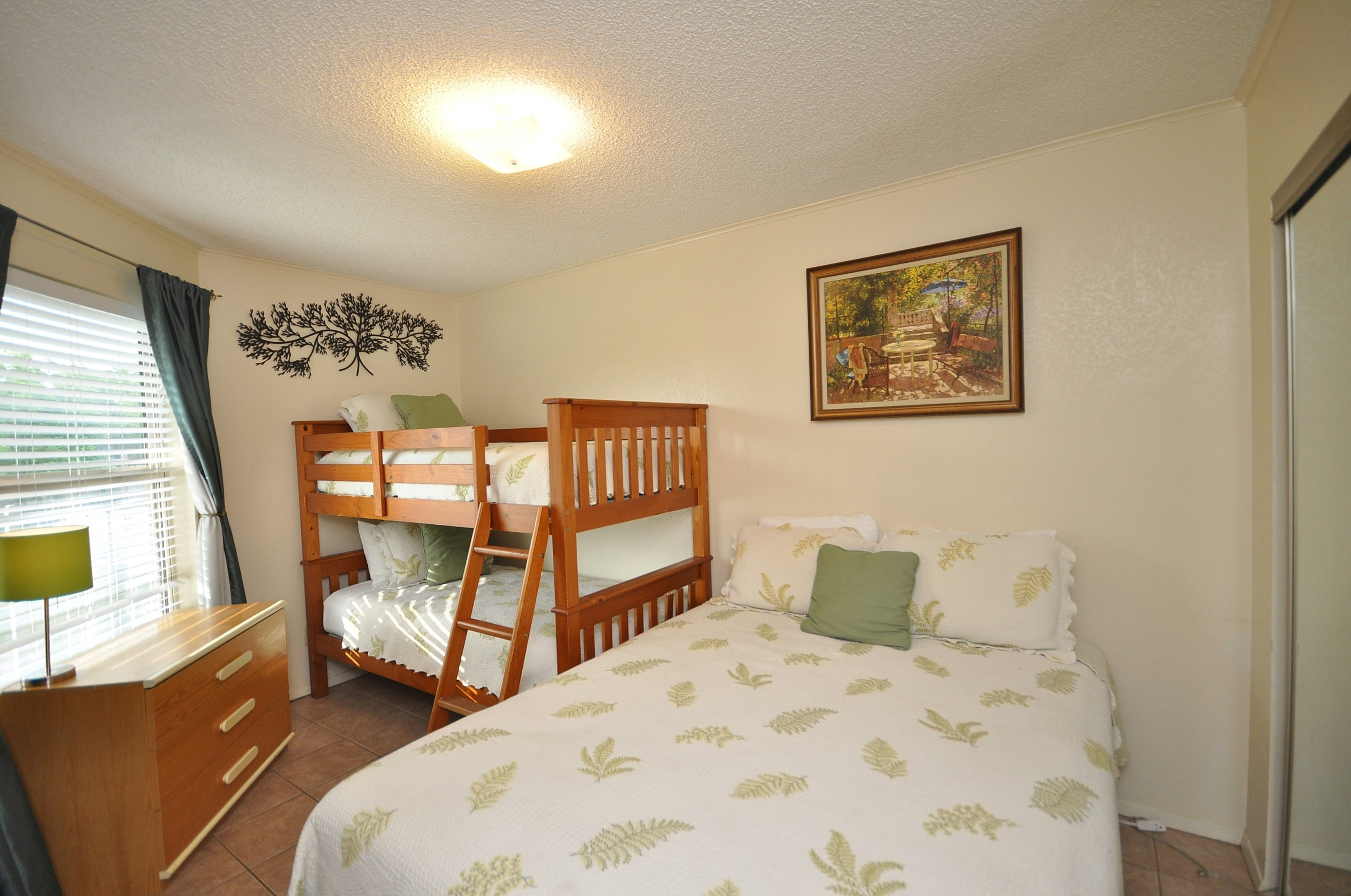 Secondary bedroom has flexible sleeping accommodations.