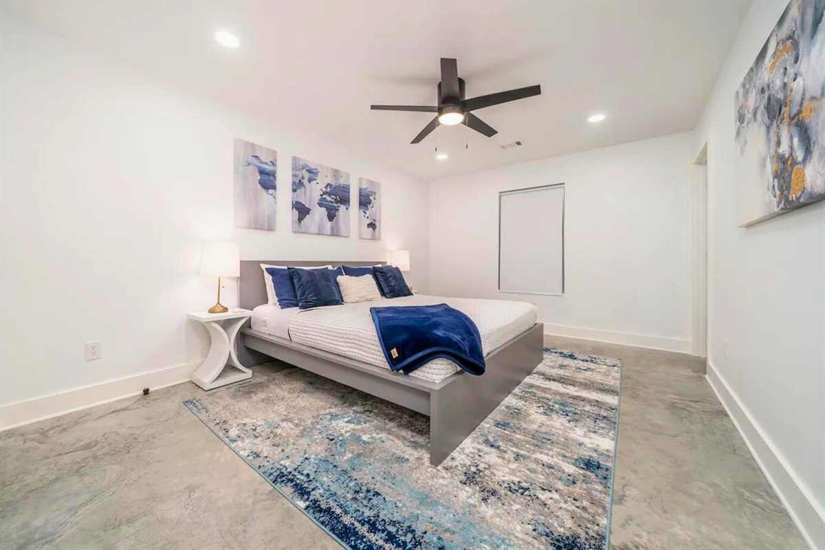 [Bedroom 5] Another King Sized Bed, With Hints of Blue Throughout the Room.