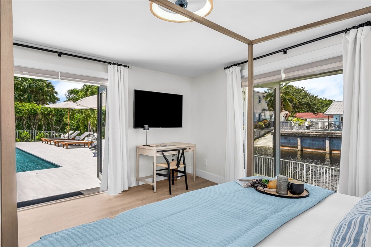 The primary king suite feels like your own private resort—featuring panoramic views of the pool and lake, seamless indoor-outdoor flow, and a newly renovated spa-inspired ensuite. Thoughtfully styled with designer finishes.