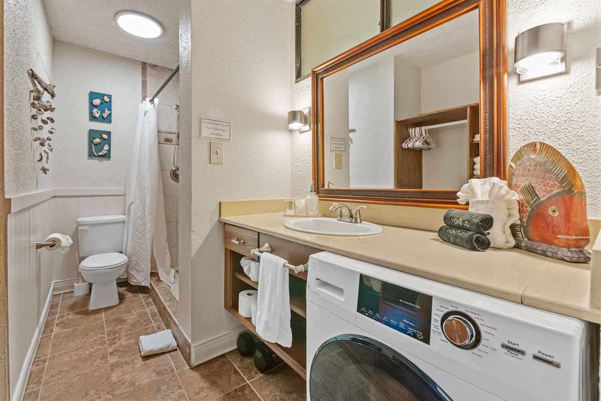 Laundry machine in the guest bathroom