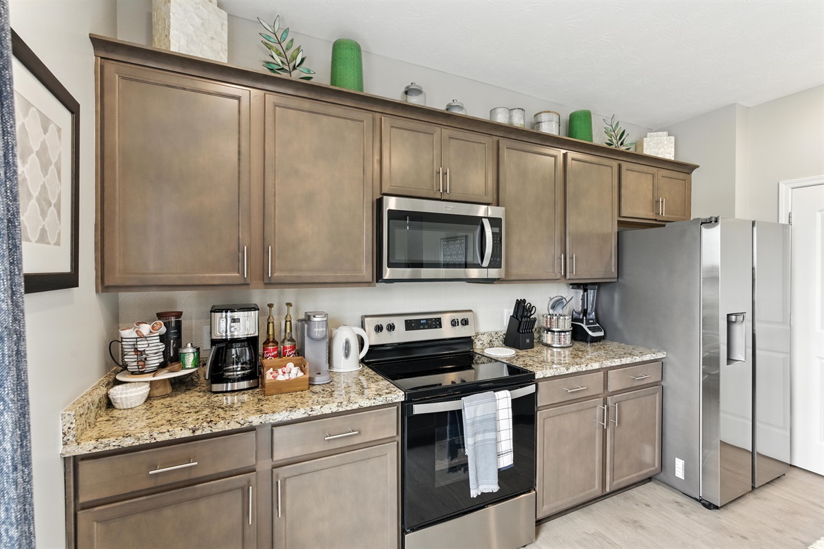 Spacious kitchen with refrigerator and all essentials