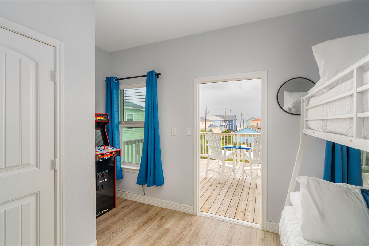 Wave Room alt — arcade hallway right outside the door. Play to pillows in seconds.