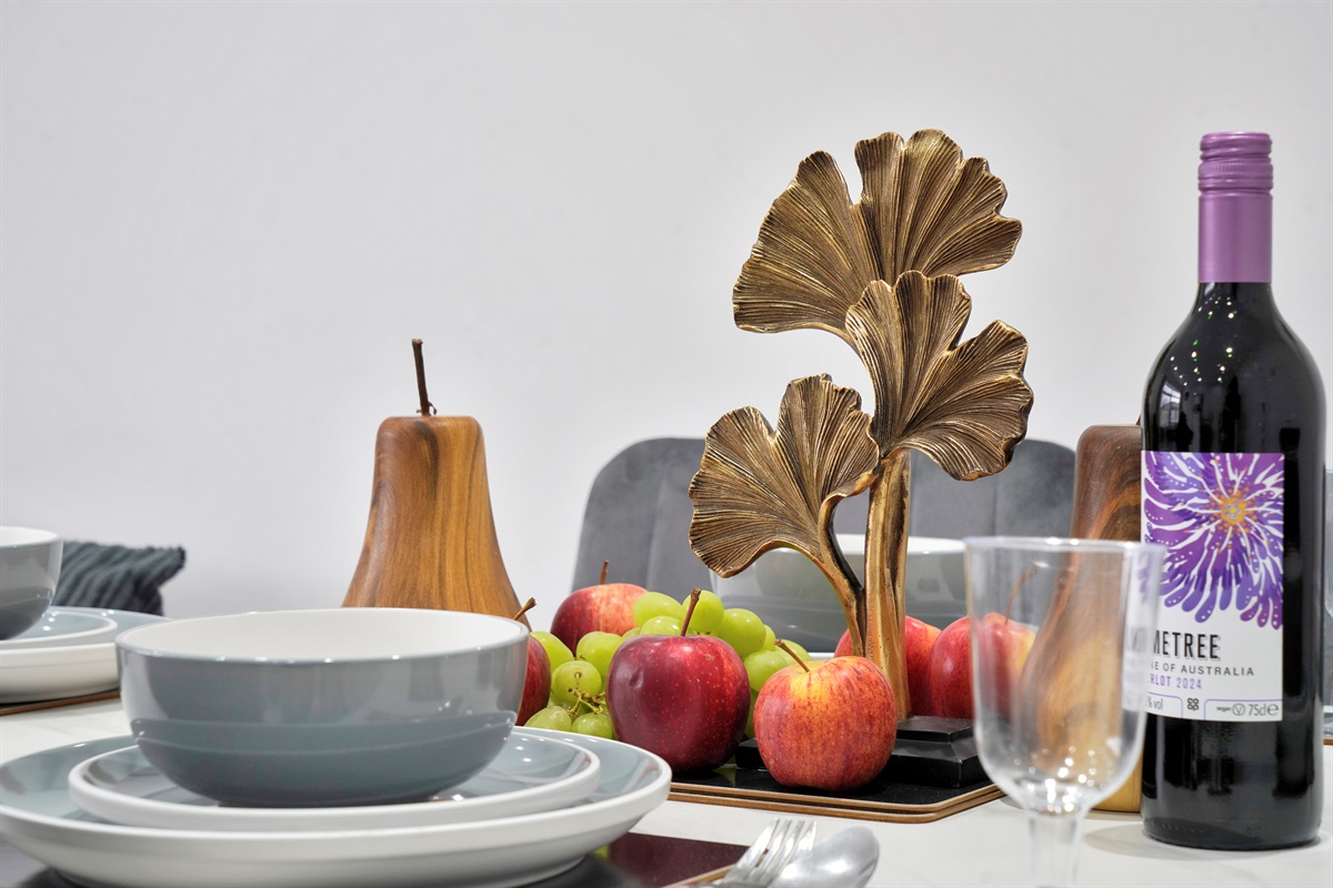 [table set for meals, wine glasses, dining space]