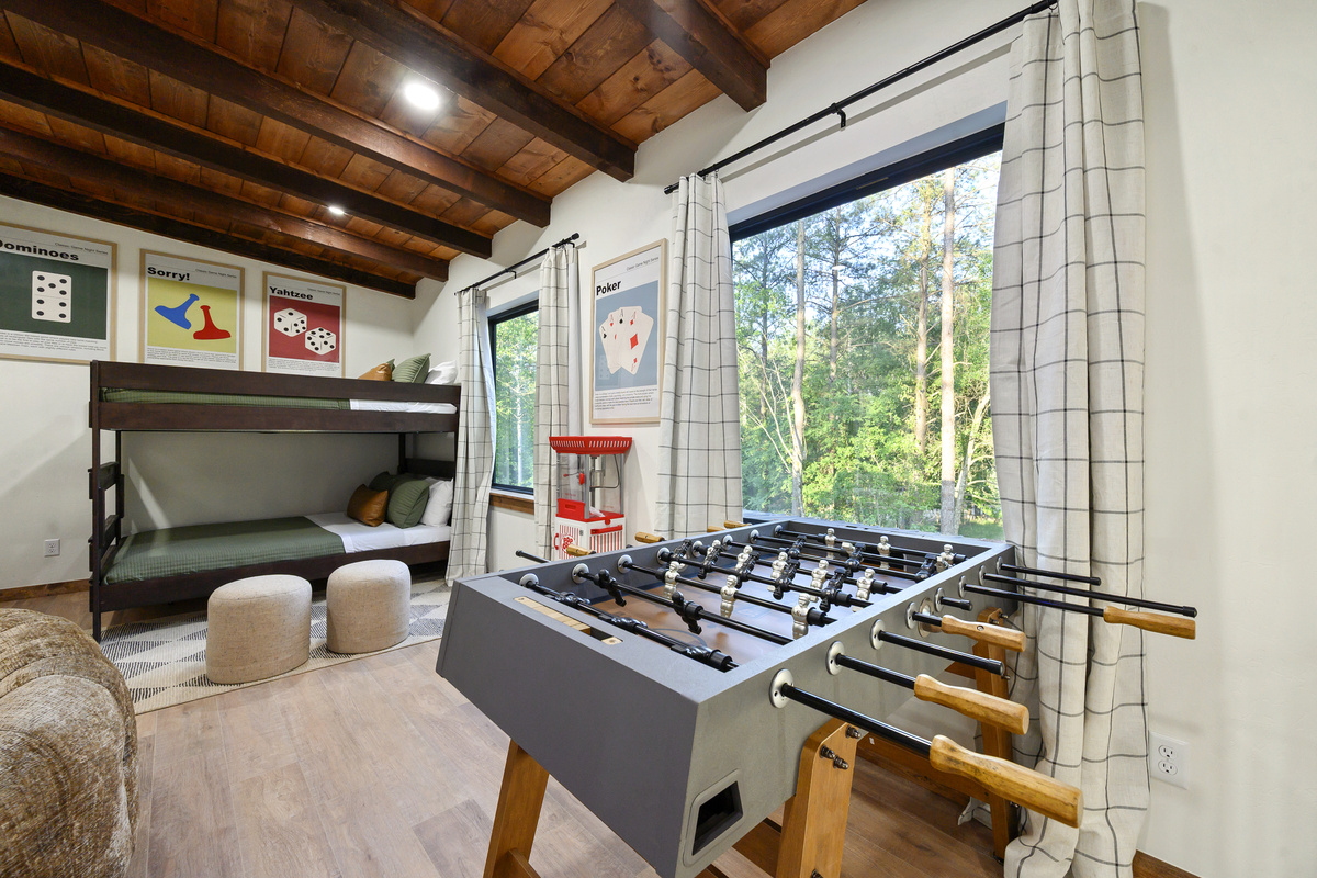 Foosball matches, popcorn breaks and bunk-bed nights make this a kids’ retreat of its own, all framed by views of the pines.
