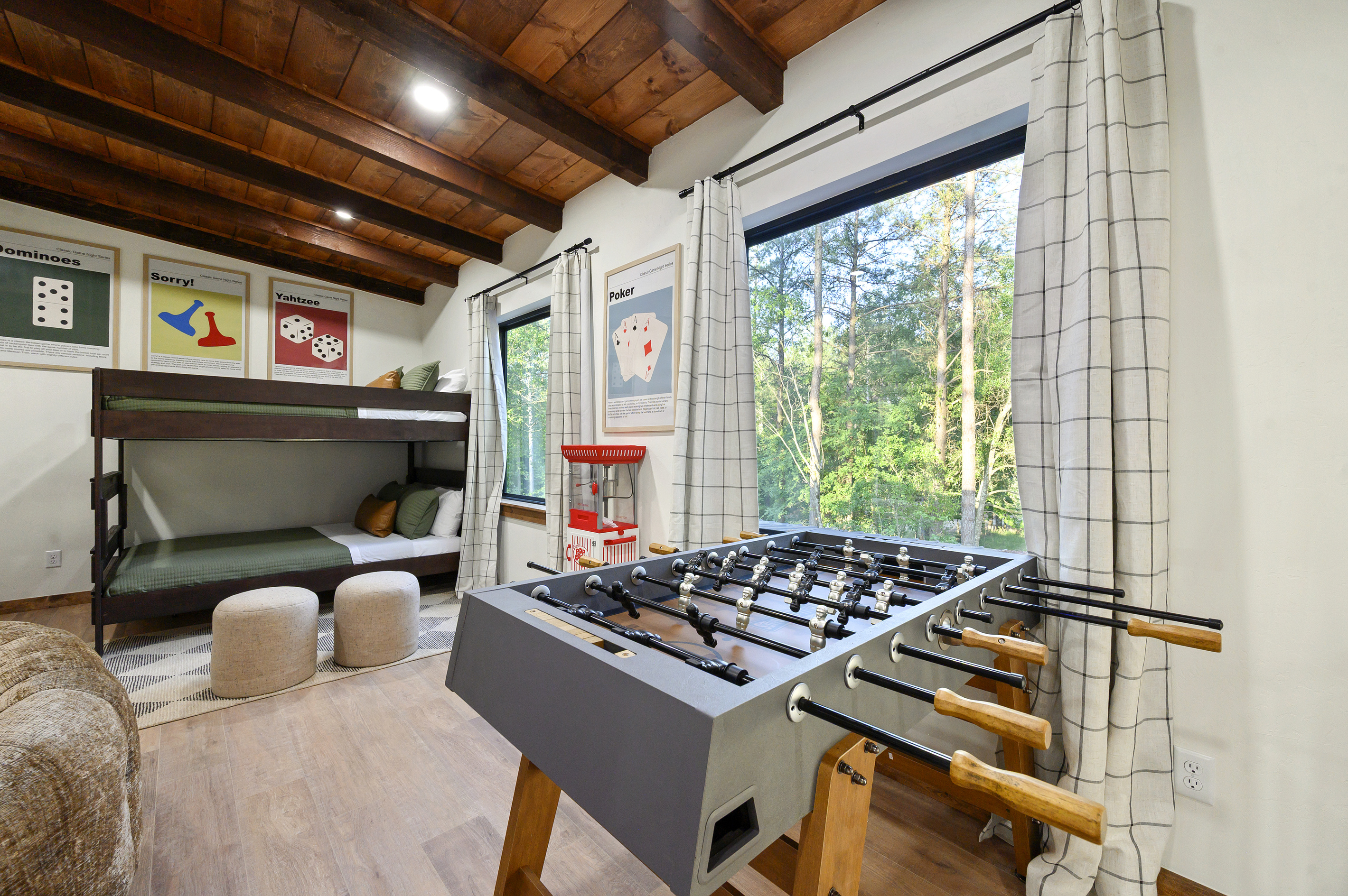 Foosball matches, popcorn breaks and bunk-bed nights make this a kids’ retreat of its own, all framed by views of the pines.
