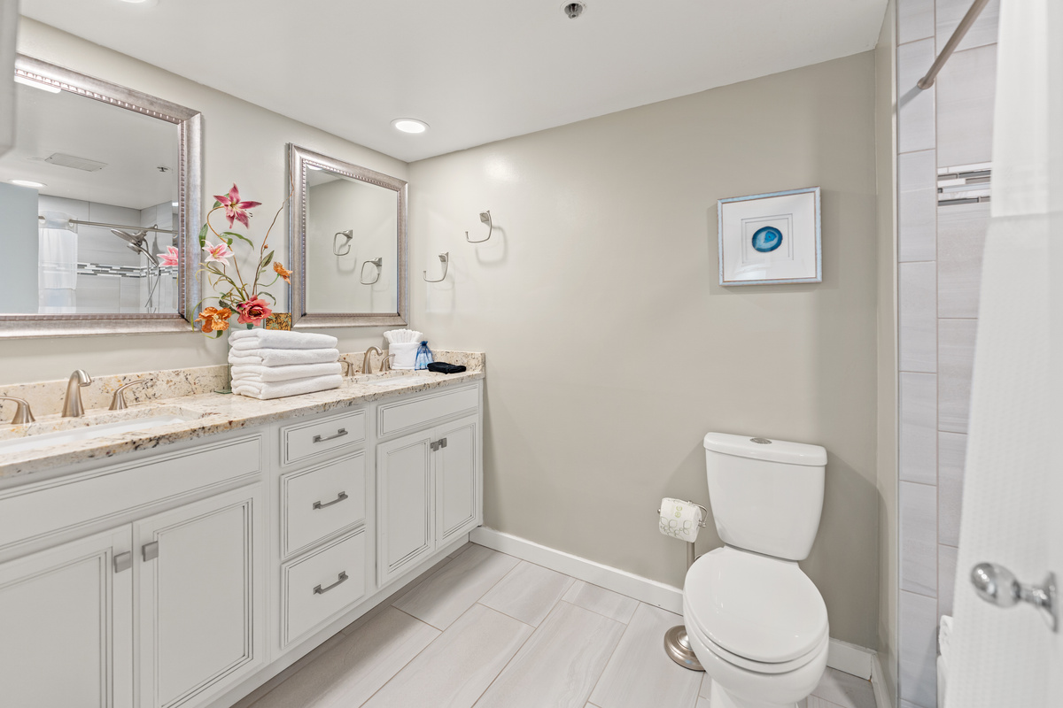 Main Bathroom with double sinks and tub/shower combo