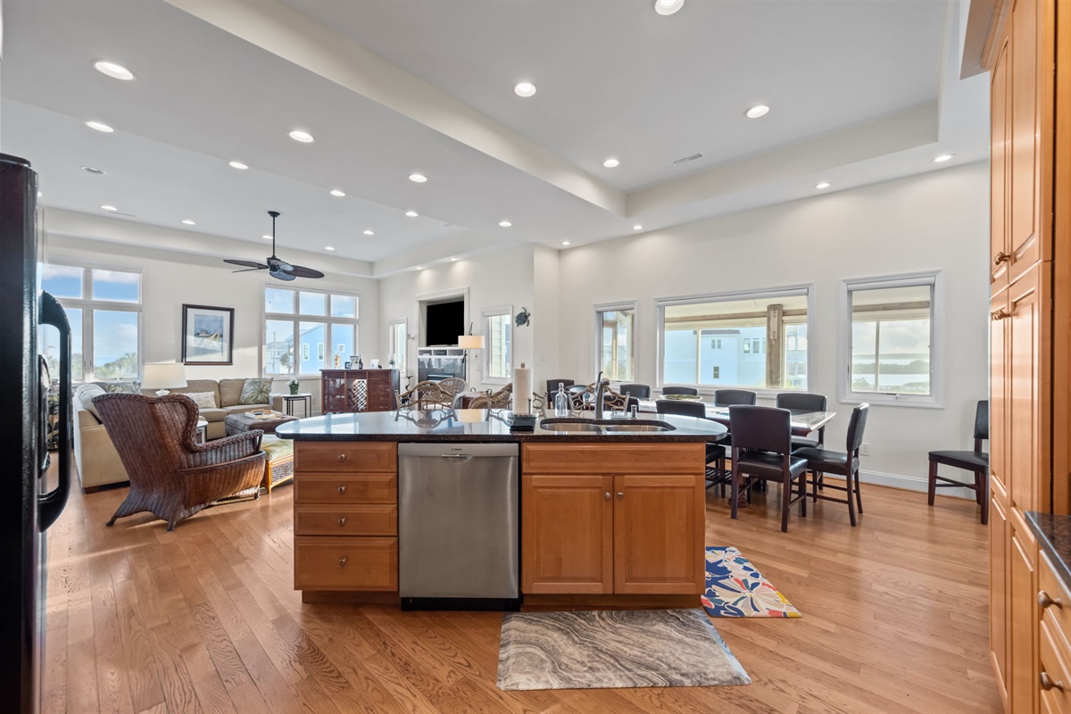 Open-concept layout with expansive windows bringing in natural light and scenic views throughout