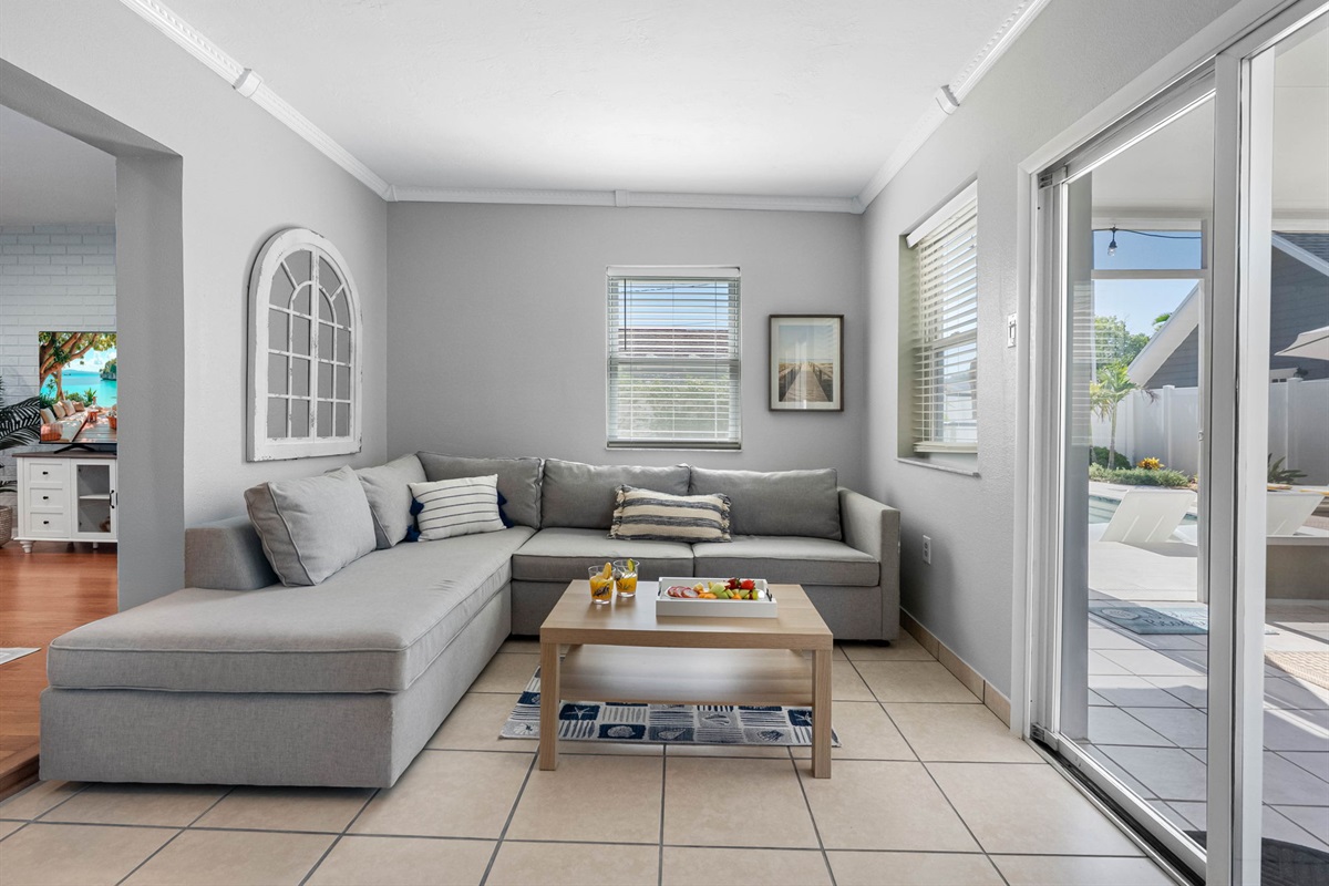 Kick back in comfort after a day of exploring—the space is tailored for relaxation with a large TV, soft lighting, and comfortable seating.