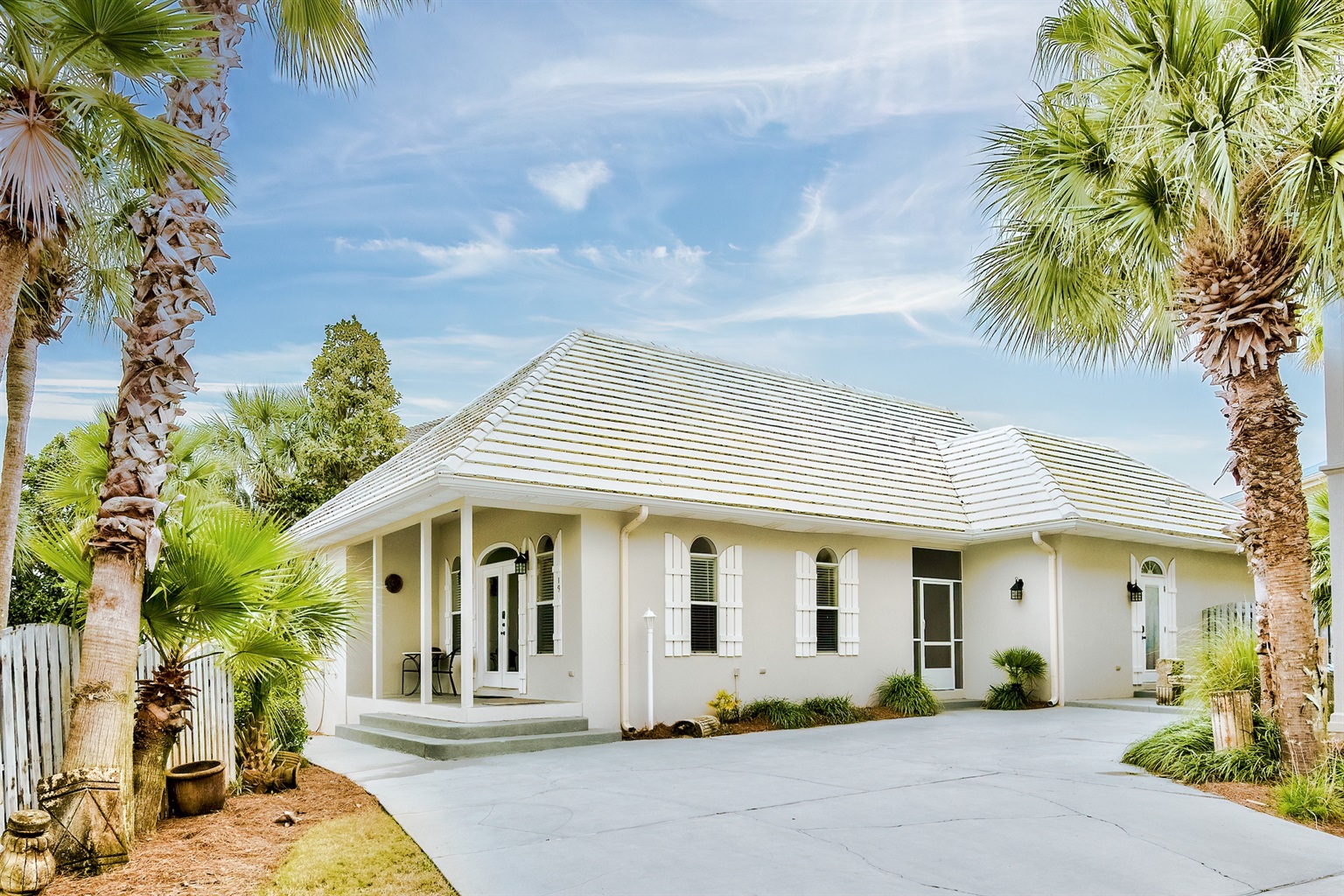 Diamond Cove exterior with private driveway and tropical landscaping