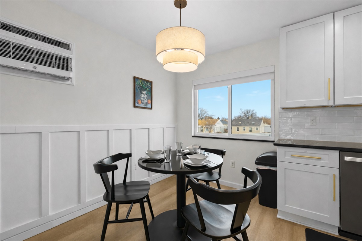 Enjoy meals in this bright, modern dining nook with stylish seating, warm lighting, and a cozy setup perfect for everyday dining.