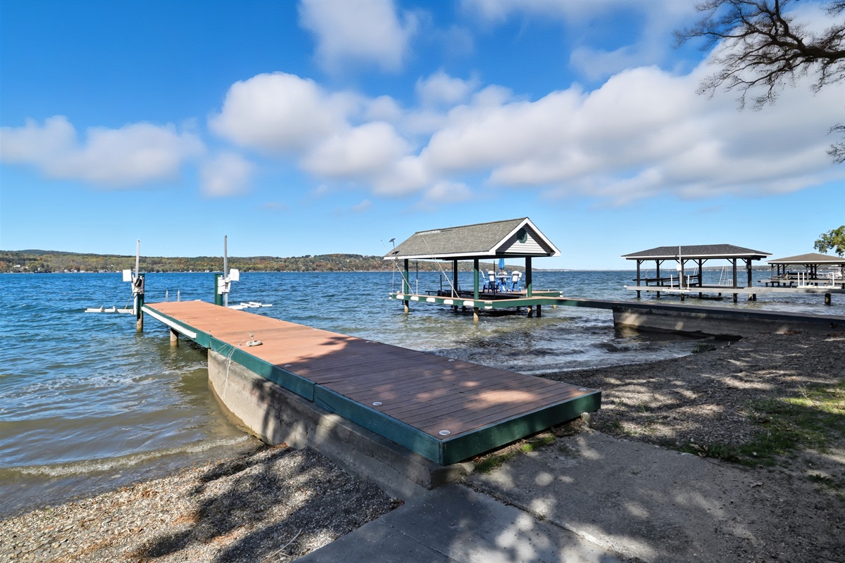 2 docks stretching over the calm waters of the lake.