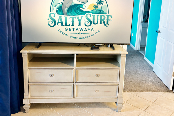 The living room TV is a 65” Samsung smart tv
