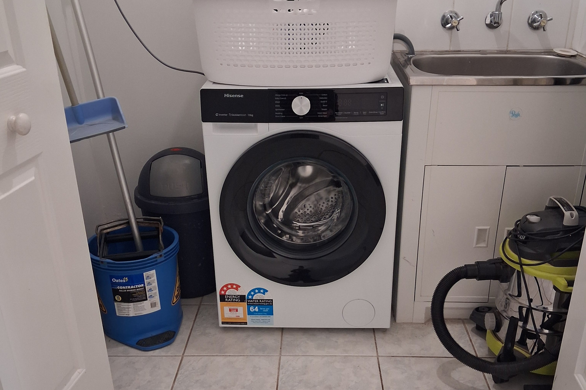 European style laundry with front load washing machine