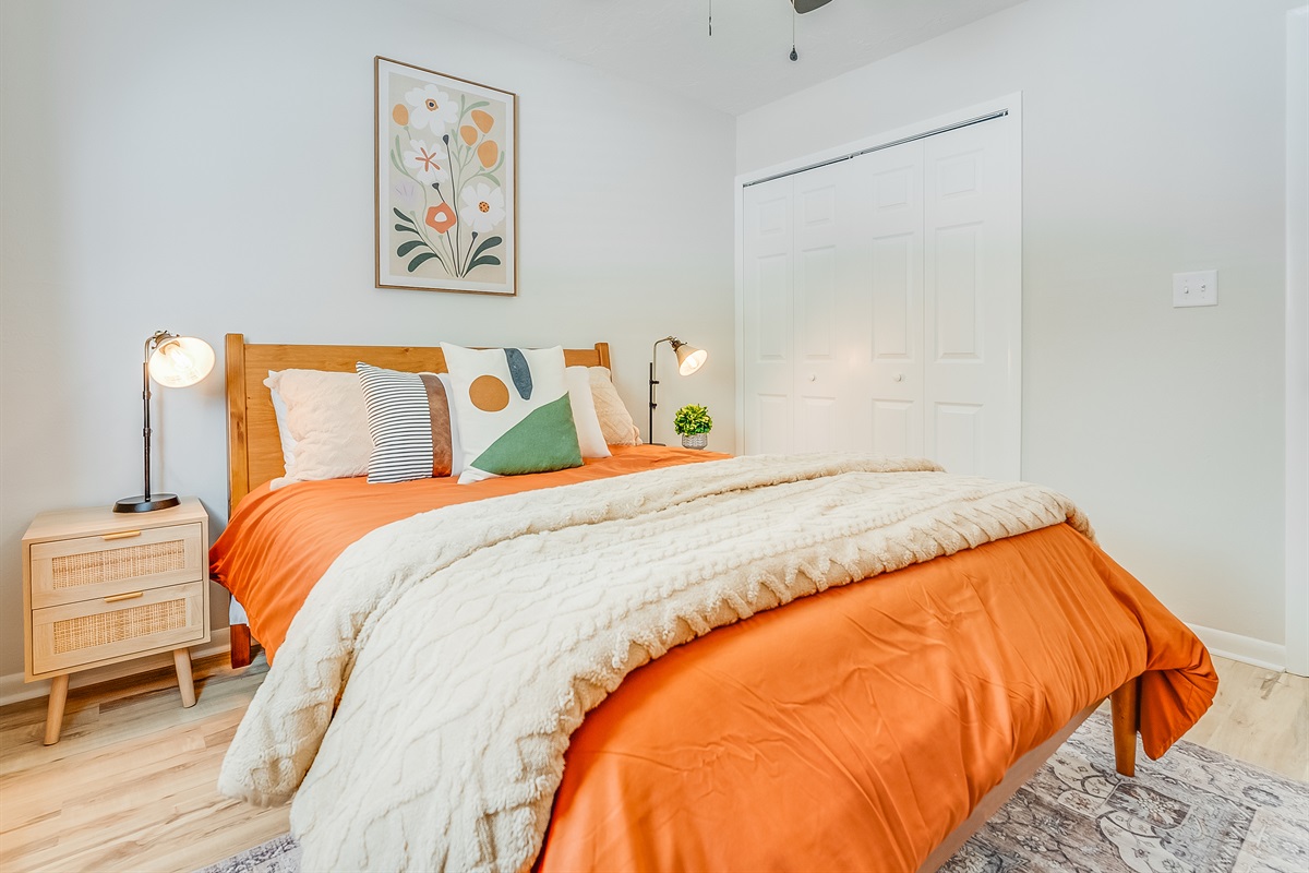 A comfortable queen bed and natural light welcome you in.