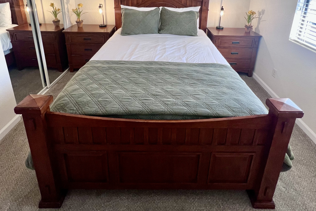 Unwind in this third bedroom with a plush queen-size bed ensures a restful night's sleep.