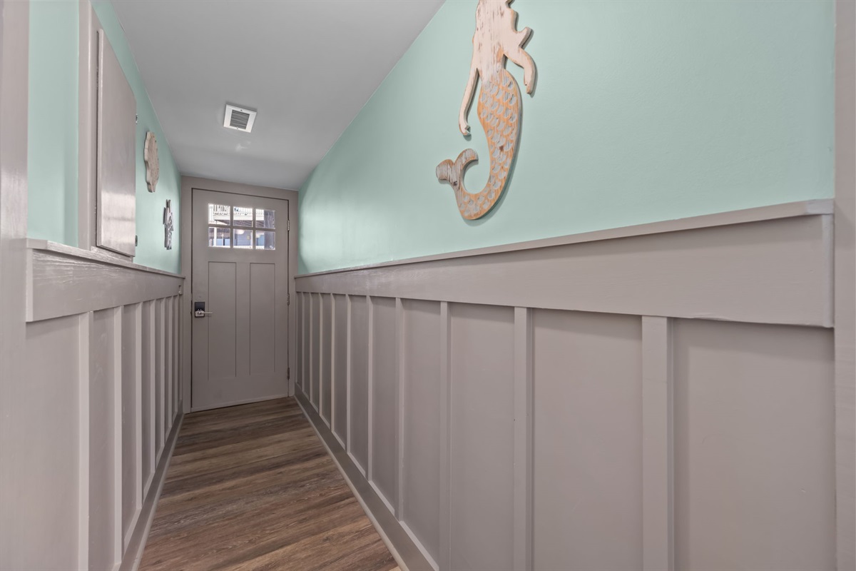 Entryway hallway with beach inspired d&eacute;cor and coastal finishes&mdash;setting the tone the moment you arrive