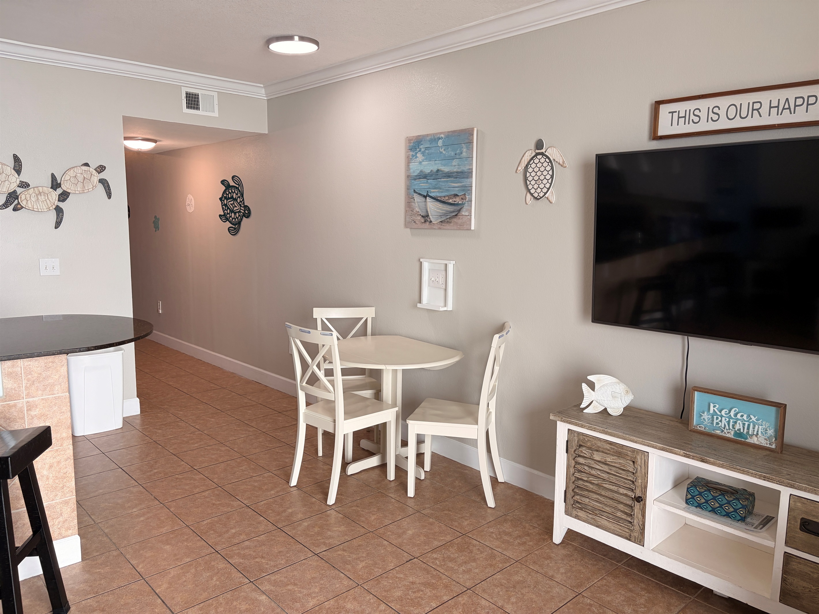 Dining area besides bar stools