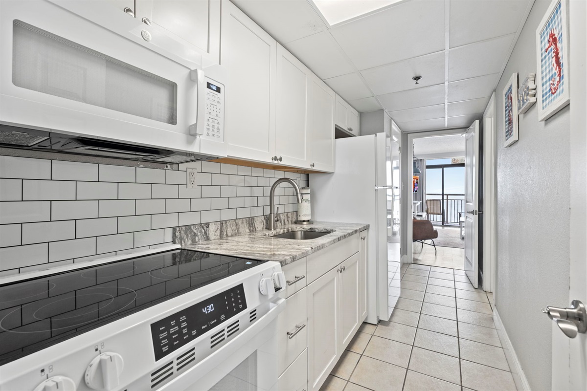 Beautiful Modern Kitchen with granite countertops and subway tile backsplash
