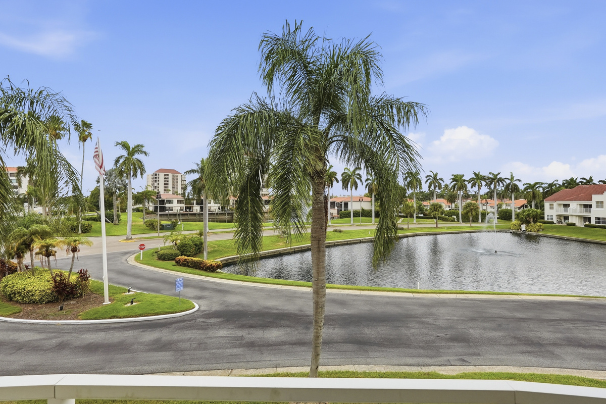 Step outside onto your private balcony and take in peaceful views of the water and the surrounding neighborhood. It's the perfect spot to enjoy your morning coffee, unwind with an evening drink, or simply soak in the beautiful Florida scenery.