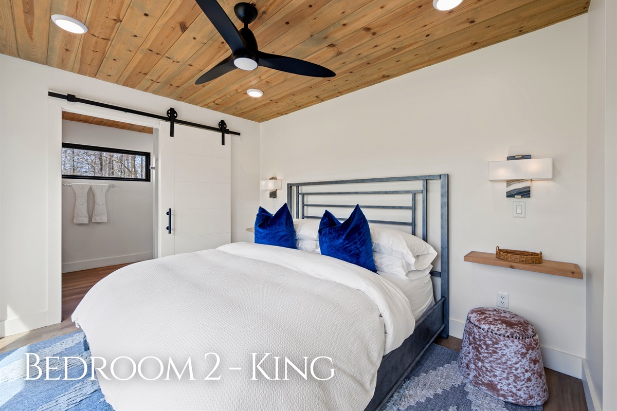 Another king bedroom carries the same inviting feel, combining comfort, simplicity, and thoughtful details throughout the space.