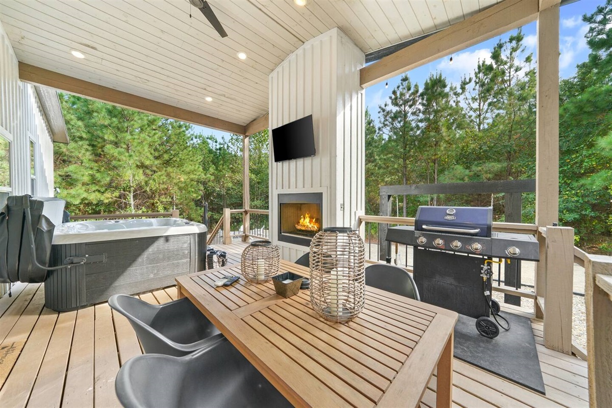 Dine al fresco with forest views, fire up the gas grill for a feast, then unwind in the bubbling hot tub under the stars.