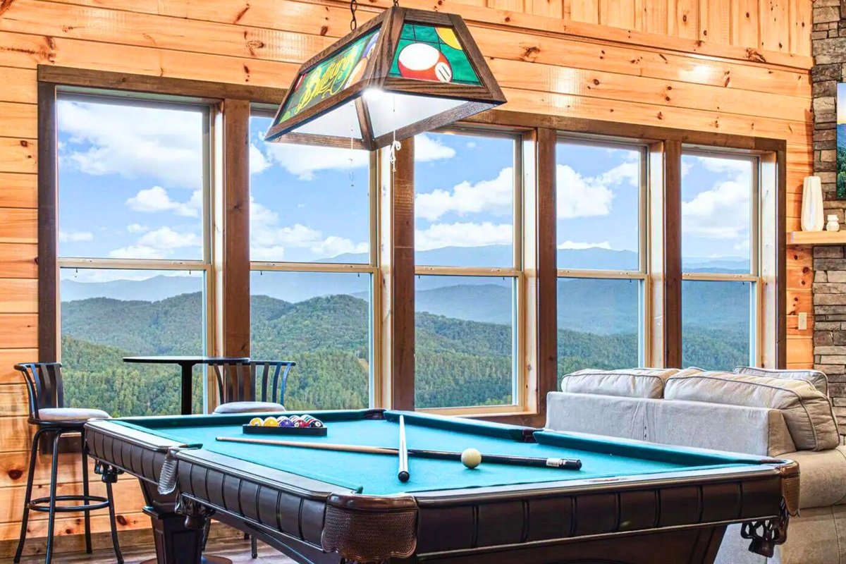 Pool Table with Lighting and Plenty of Seating to Accommodate Everyone's Needs