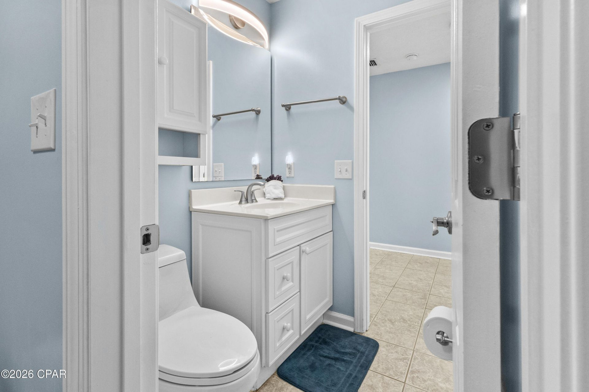 Thoughtfully designed layout with hallway half bath access to the newly tiled master shower.