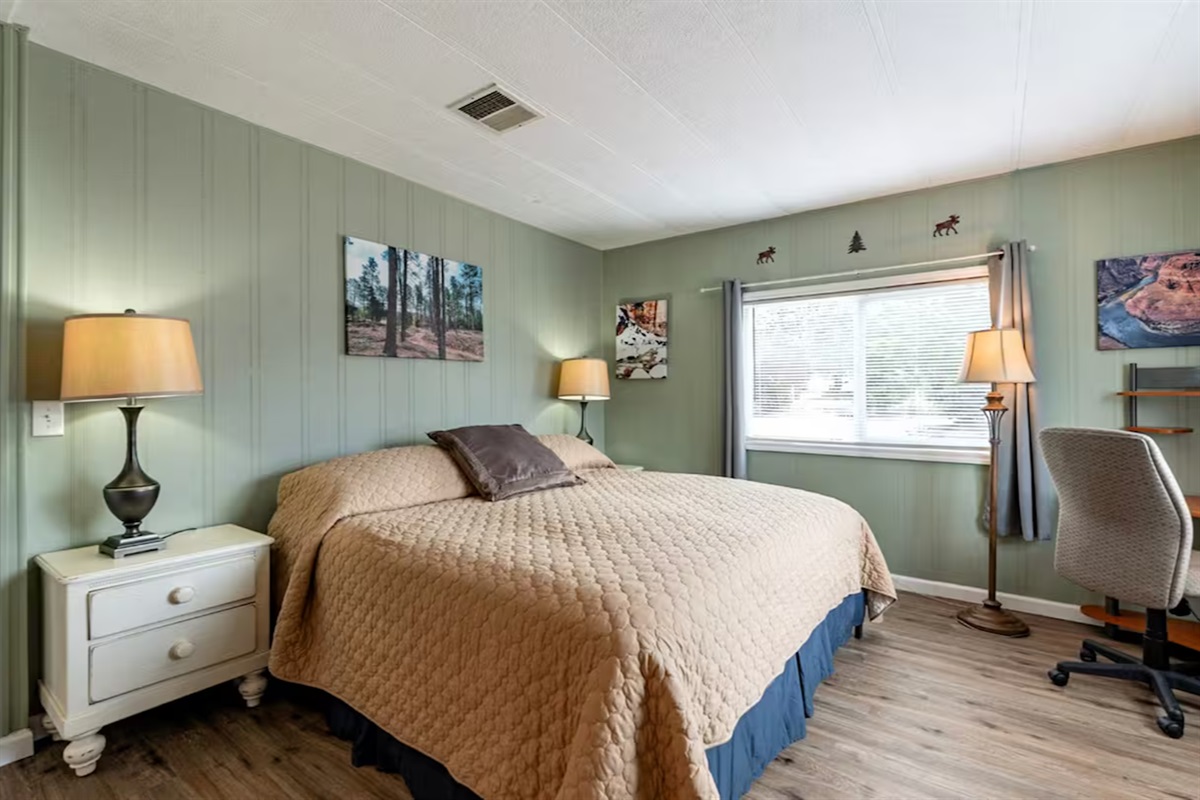 Unwind in a peaceful primary suite with a plush king bed..