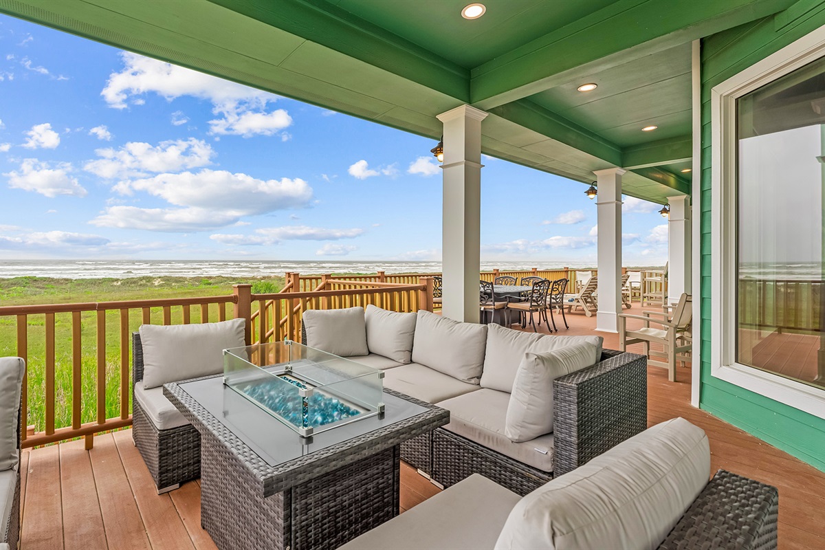 Rear Patio: Lounge seating around a fire pit table.