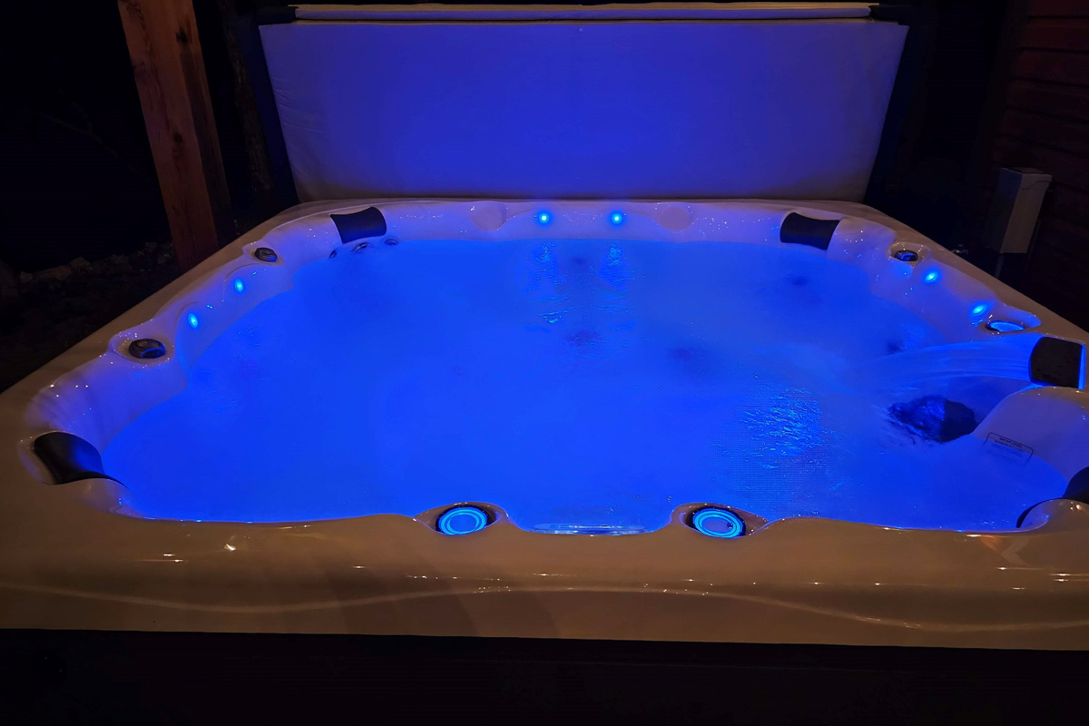 Relax under the stars in the private 8 person hot tub after Branson adventures.