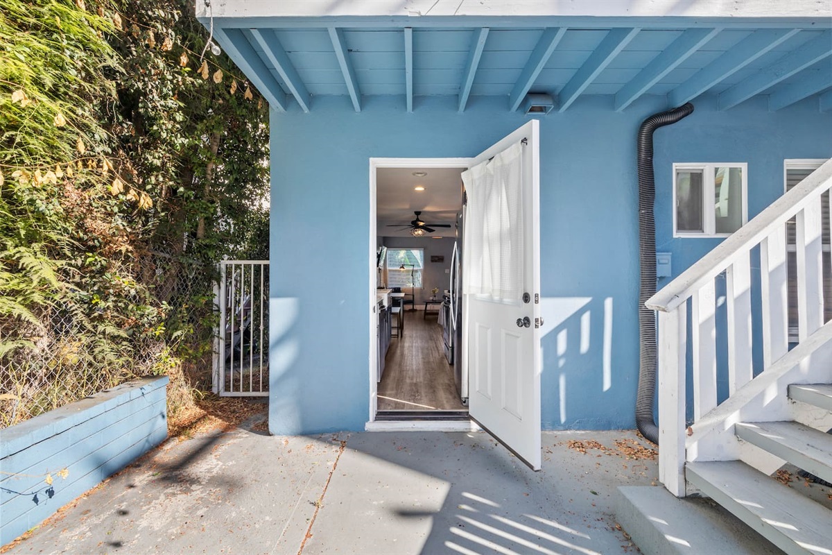 Welcoming exterior showcasing the entrance of the house, designed to captivate guests with its charm. The inviting doorway hints at the delightful interiors waiting inside, creating an enchanting first impression that promises a cozy retreat.