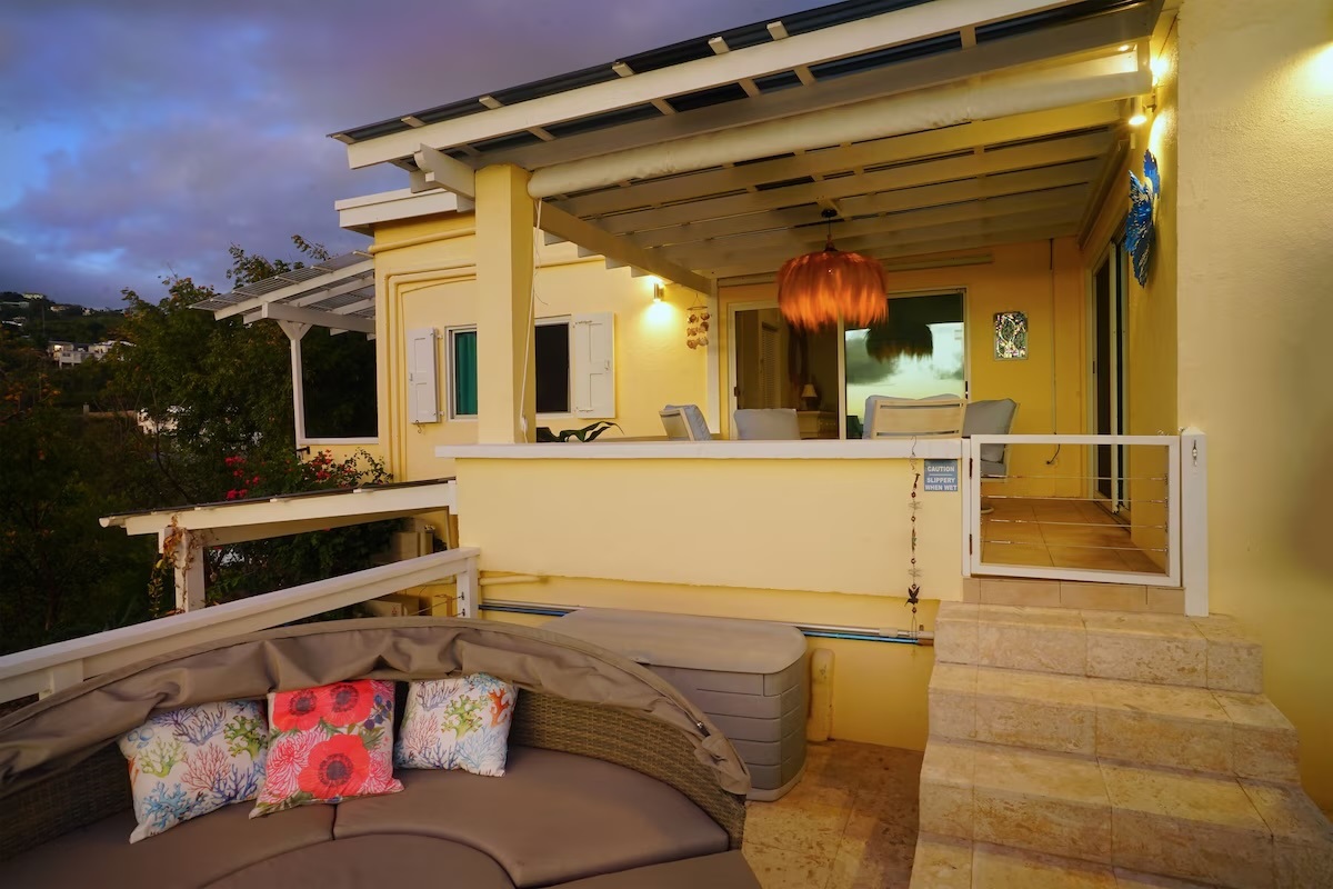 The sitting area from the pool deck - the guest room 1 is located through the sliding doors.