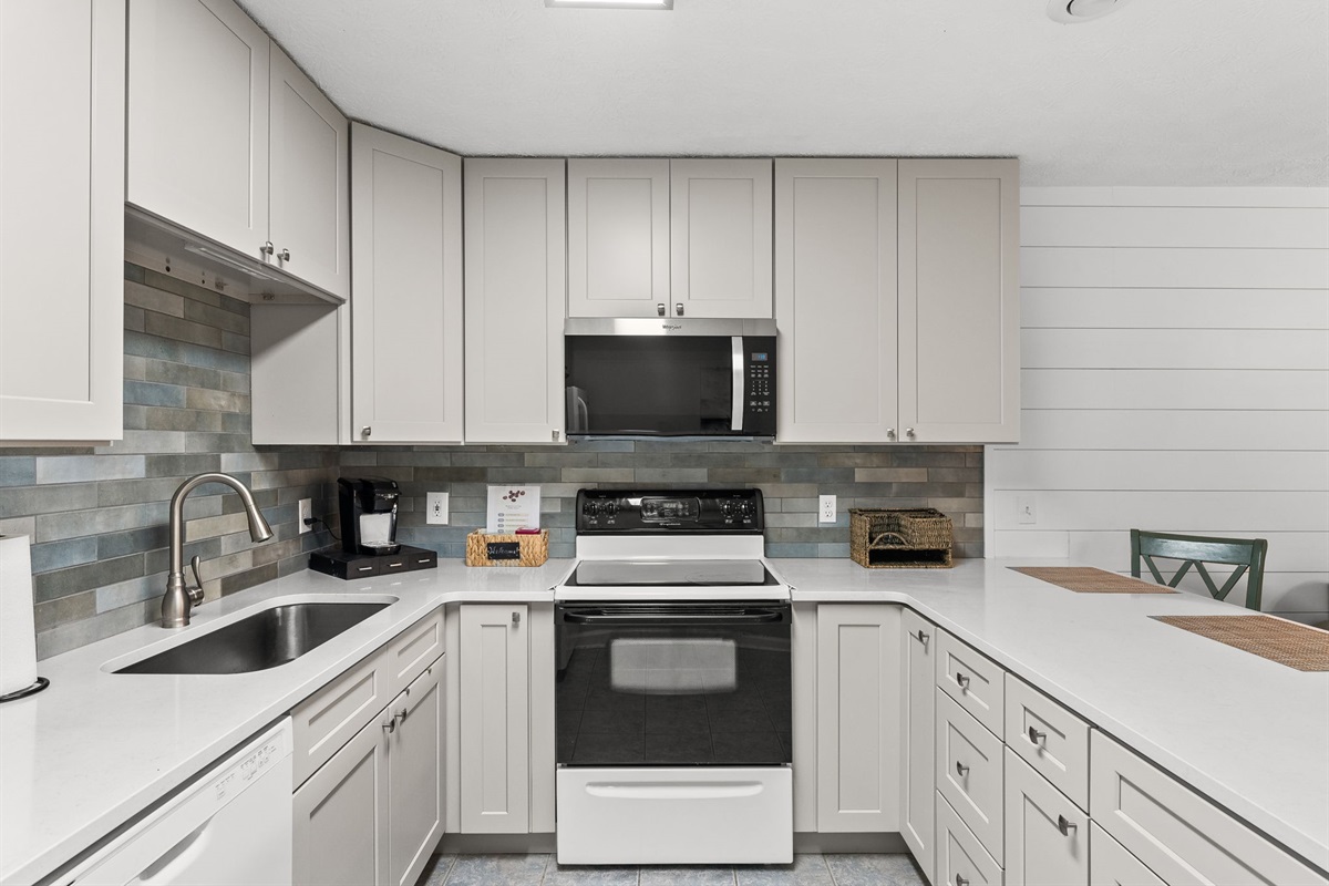 Fully refreshed kitchen with brand-new cabinets and stocked kitchen with tons of cooking utensils, cookware, and everything you need to prepare meals.