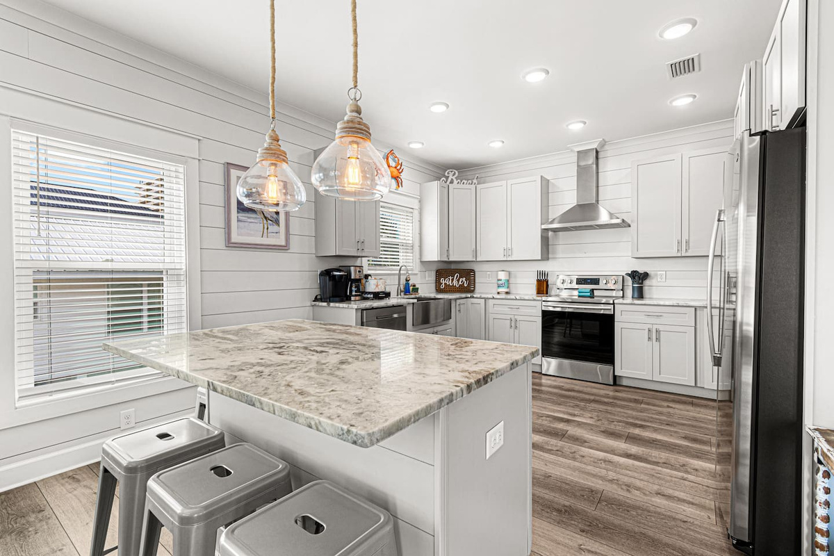 Kitchen island has tons of storage for your dry goods and will seat four. 